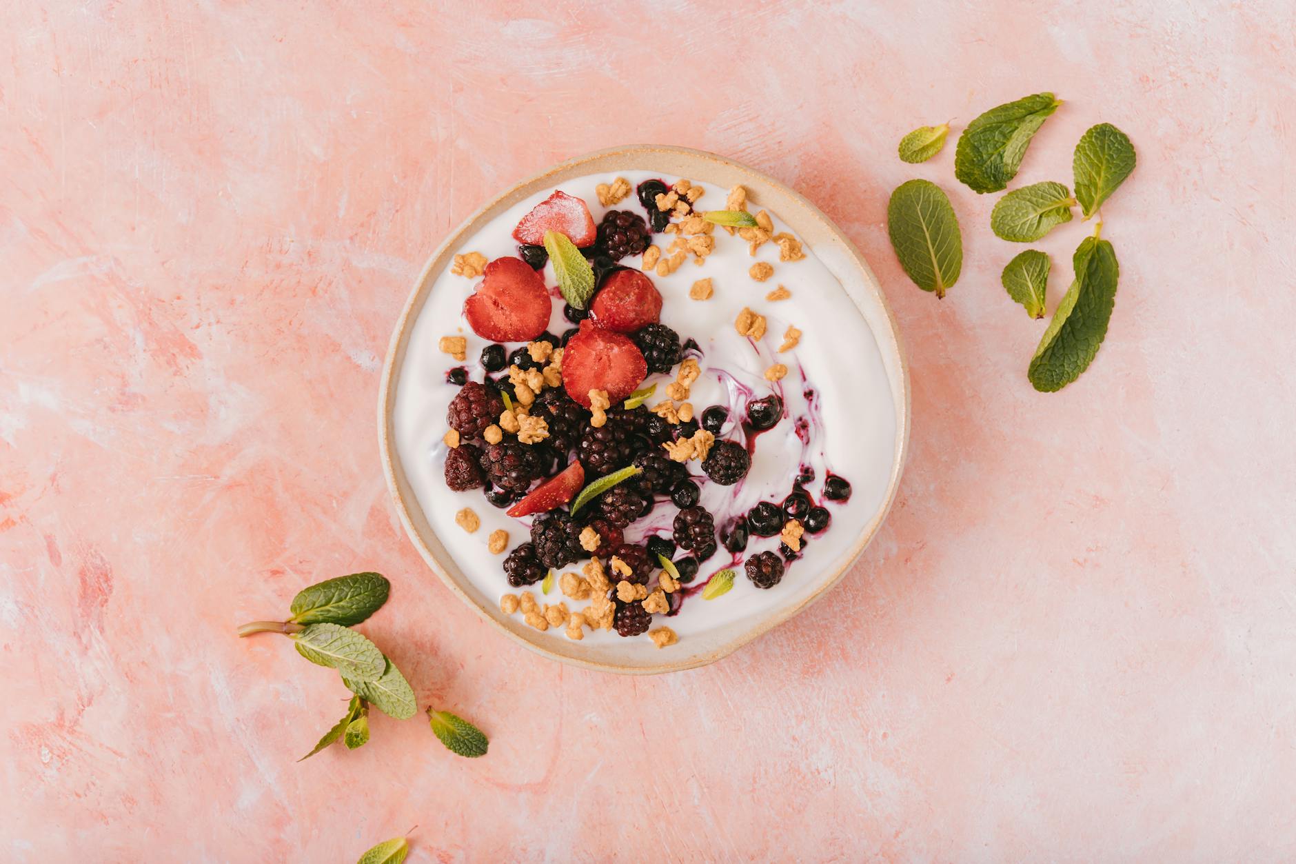 Top view of a yogurt bowl with mixed berries and granola — probiotic-rich foods