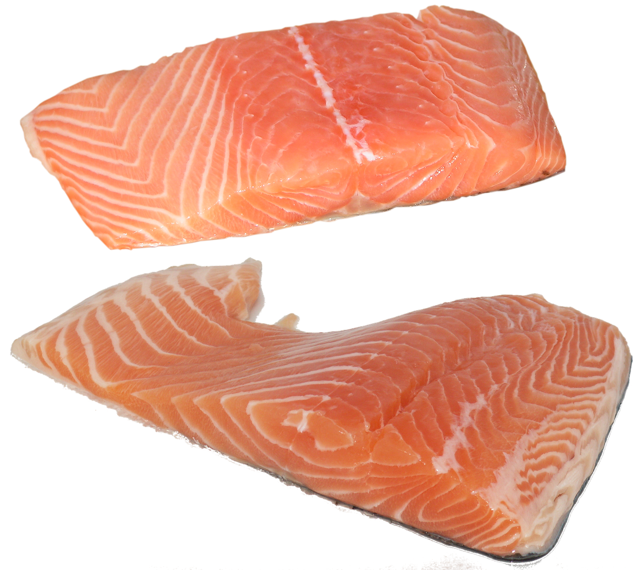 Fresh salmon fillet on a wooden cutting board, pink flesh with white fat lines visible